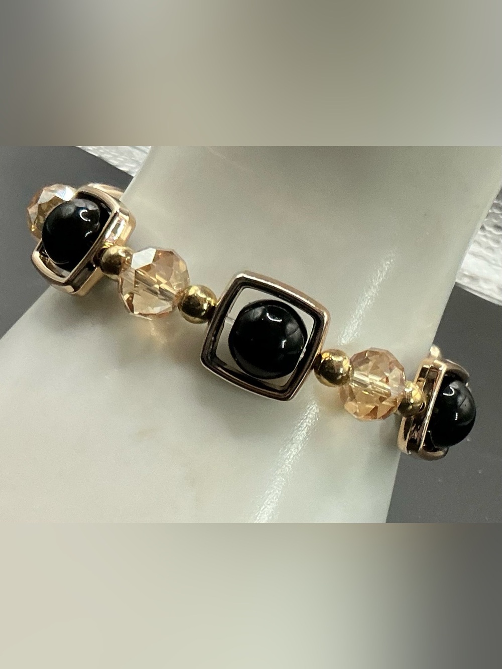 GOLD TONE BLACK BEADED BRACELET WITH CHAMPAGNE BEAD BRACELET STRETCH